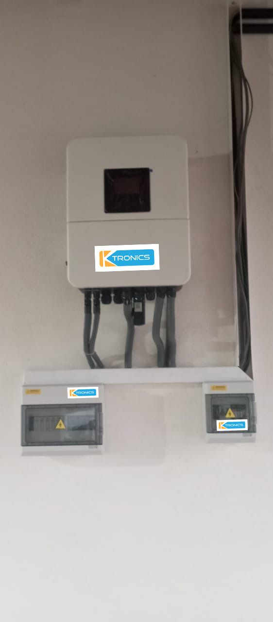 Hybrid inverter and two protection enclosures carrying KTronics labels